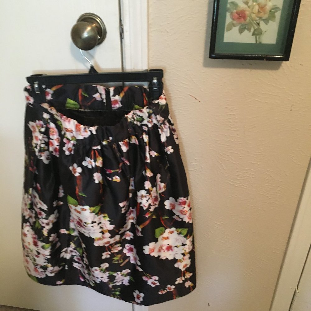 Hand sewn multi-colored skirt with lining.
